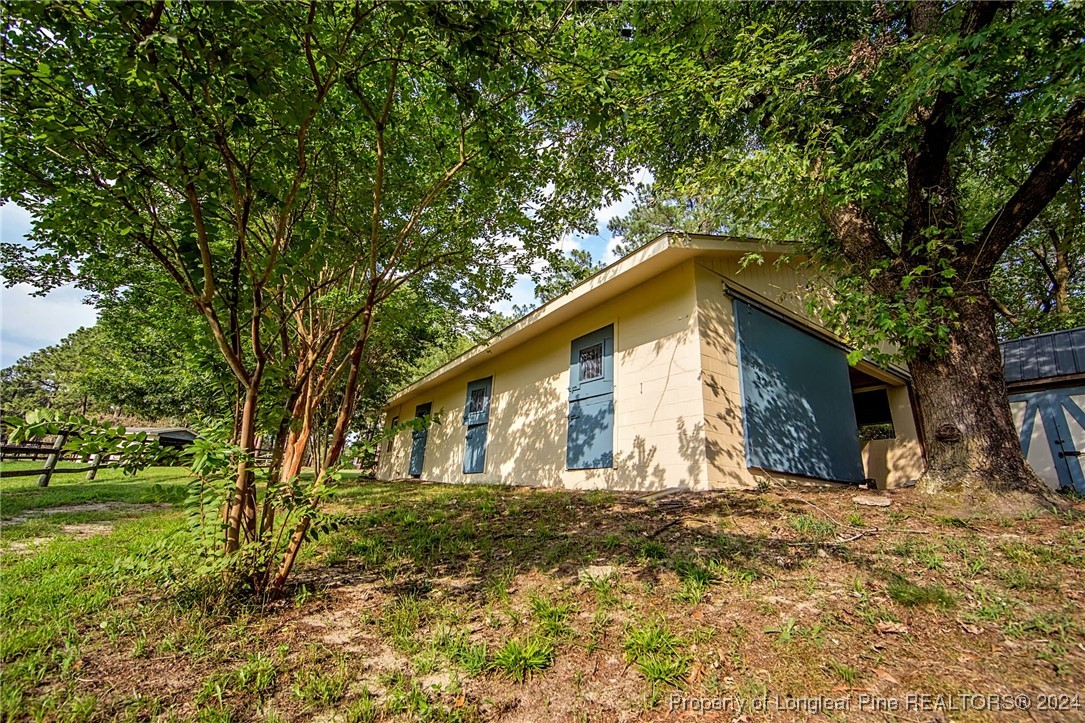 222 Goodwill Road Southern Pines, NC 28387 - Photo 44 of 49 a front view of house with yard