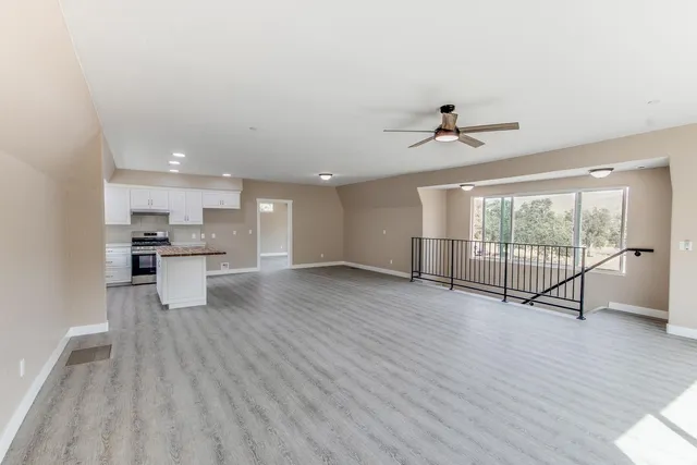 a view of kitchen with furniture and wooden floor