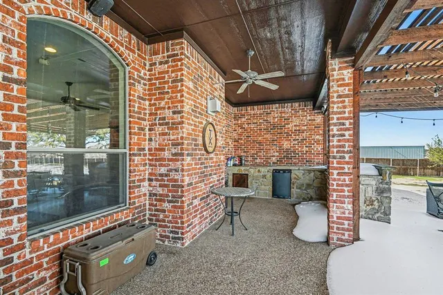 a view of a house with a snow in the background