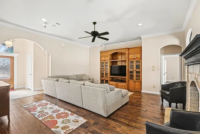 a view of a room with windows and chandelier