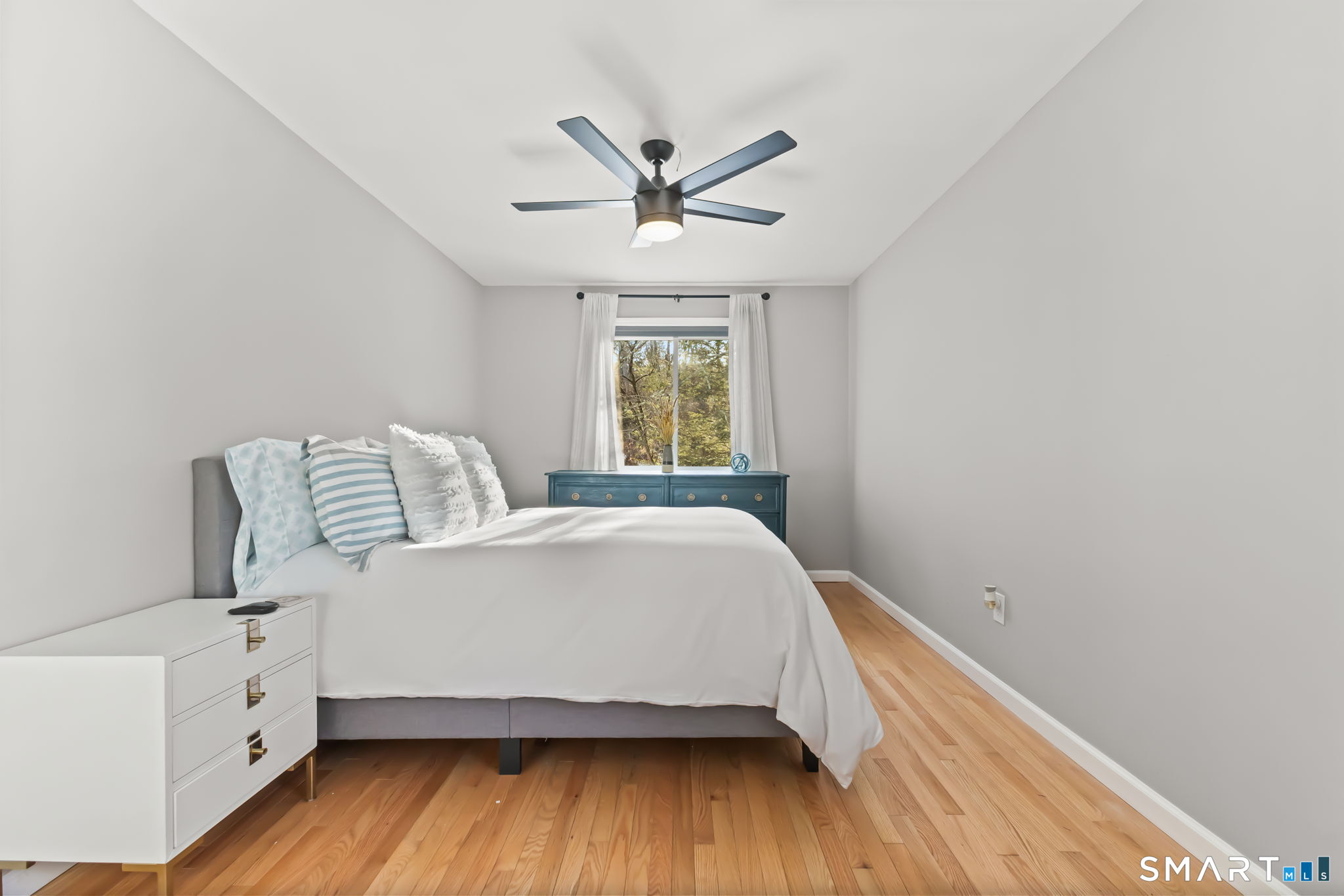 299 Redding Road Redding, CT 06896 - Photo 16 of 40 a bedroom with a bed and window
