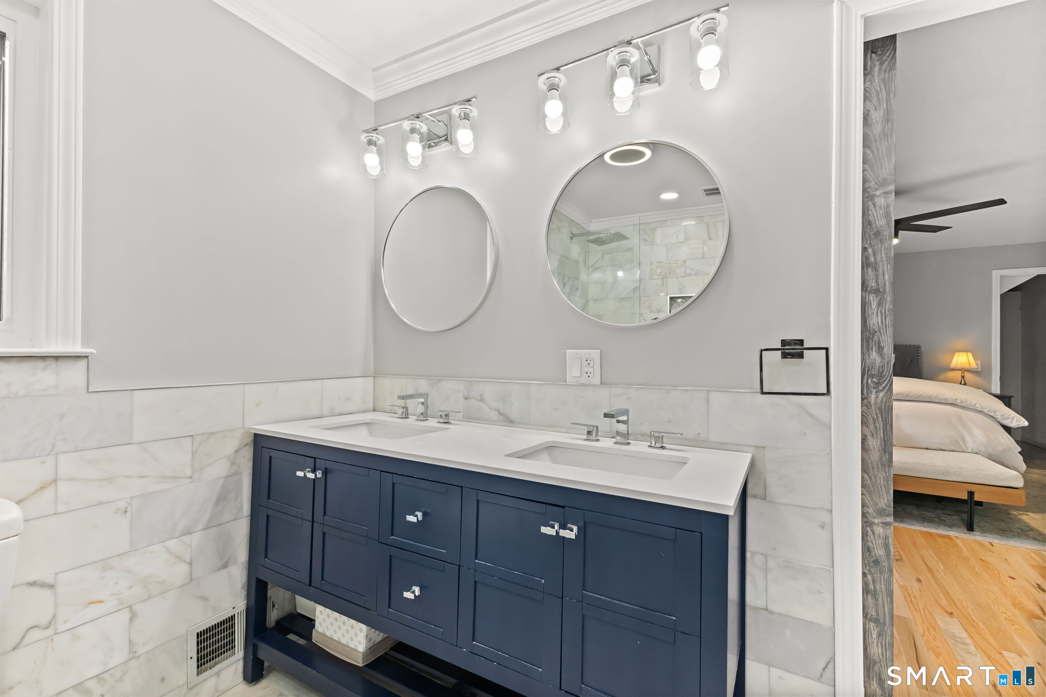 299 Redding Road Redding, CT 06896 - Photo 19 of 40 a bathroom with a double vanity sink and a mirror
