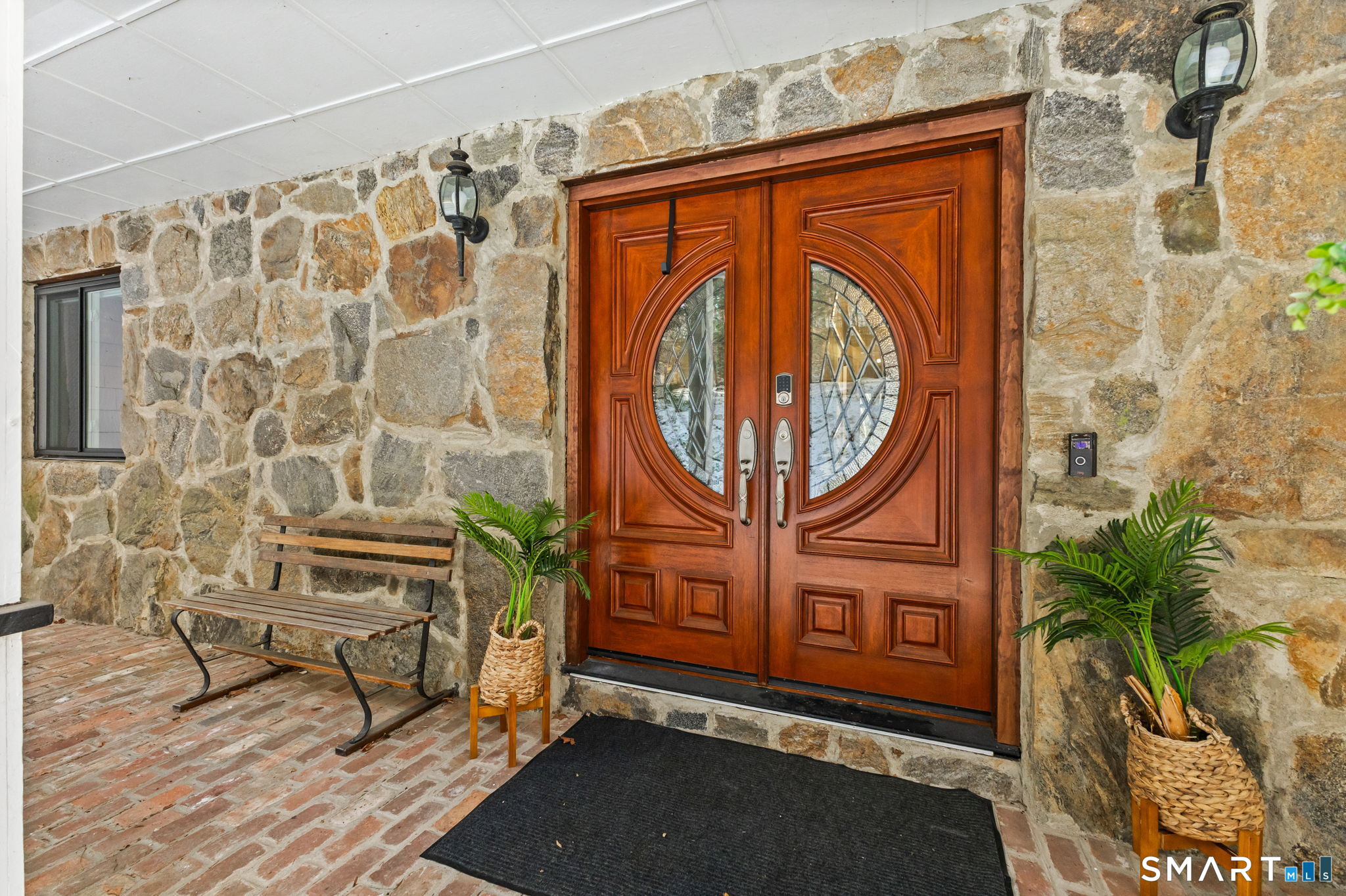 299 Redding Road Redding, CT 06896 - Photo 2 of 40 a door with sitting area