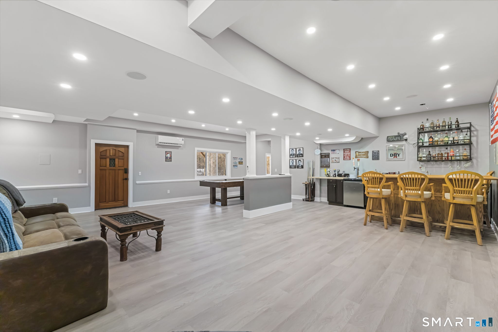 299 Redding Road Redding, CT 06896 - Photo 26 of 40 a living room with furniture and a table