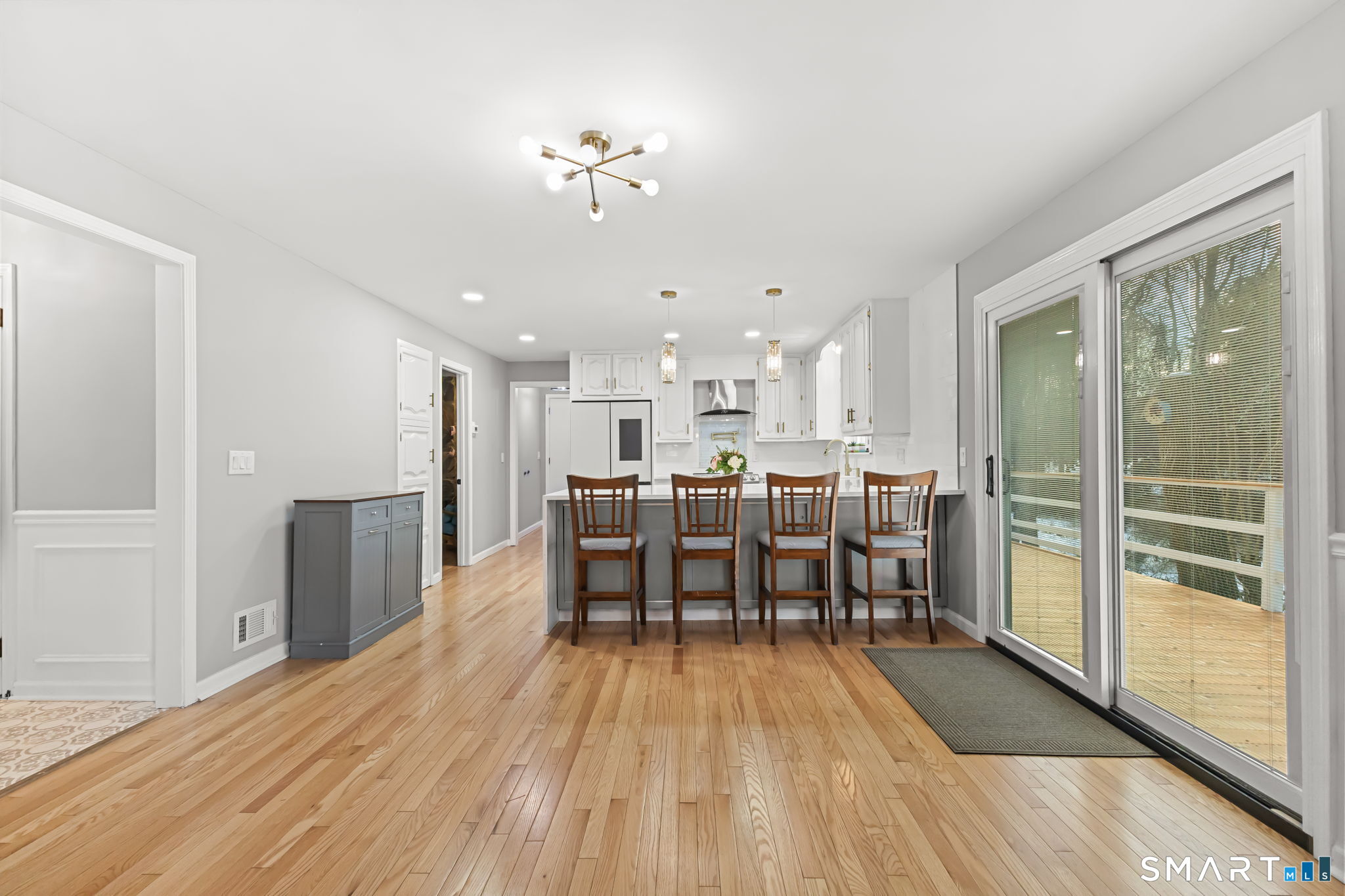 299 Redding Road Redding, CT 06896 - Photo 7 of 40 a view of a dining room with furniture window and wooden floor