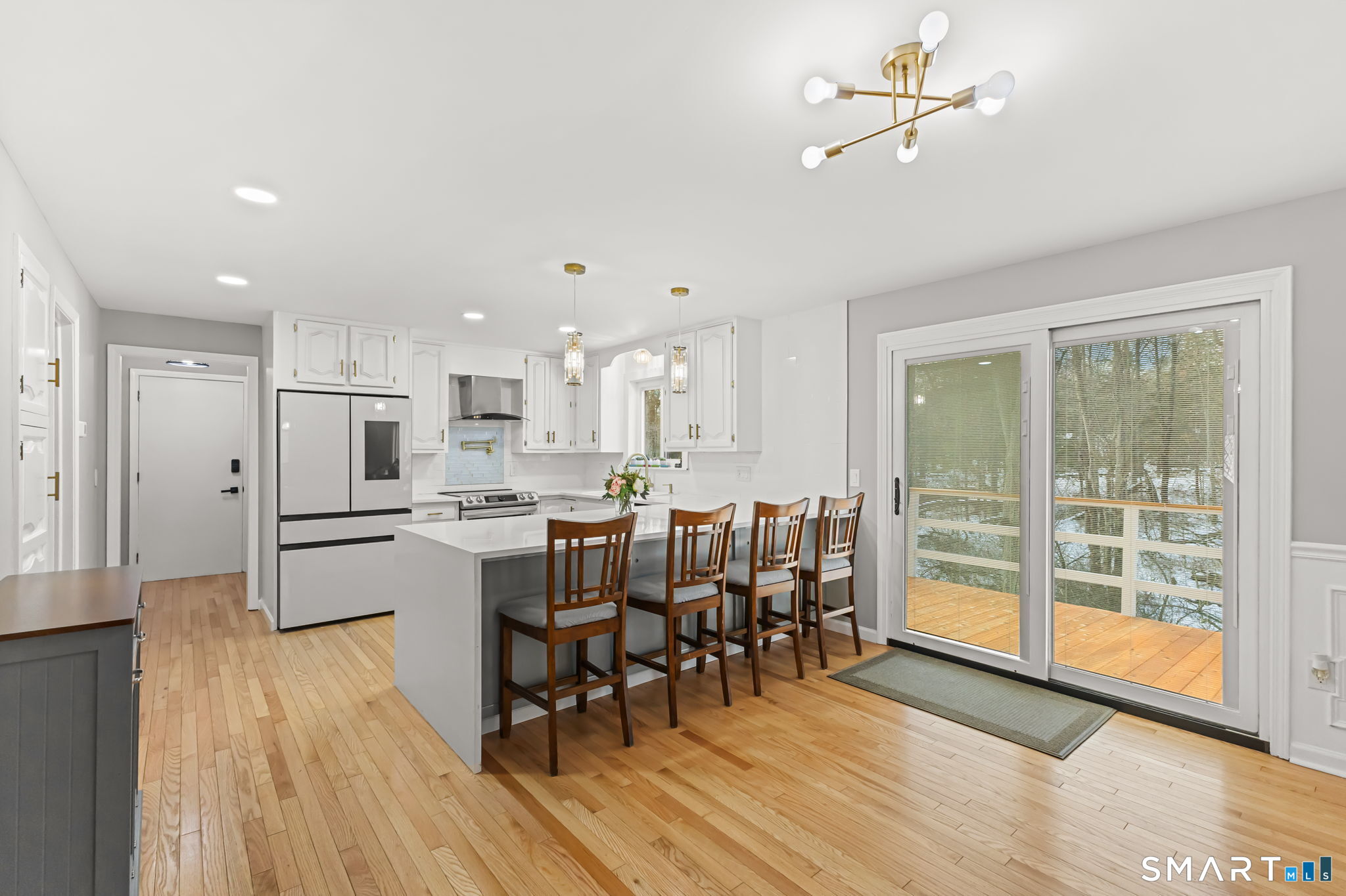 299 Redding Road Redding, CT 06896 - Photo 8 of 40 a large kitchen with a table and chairs