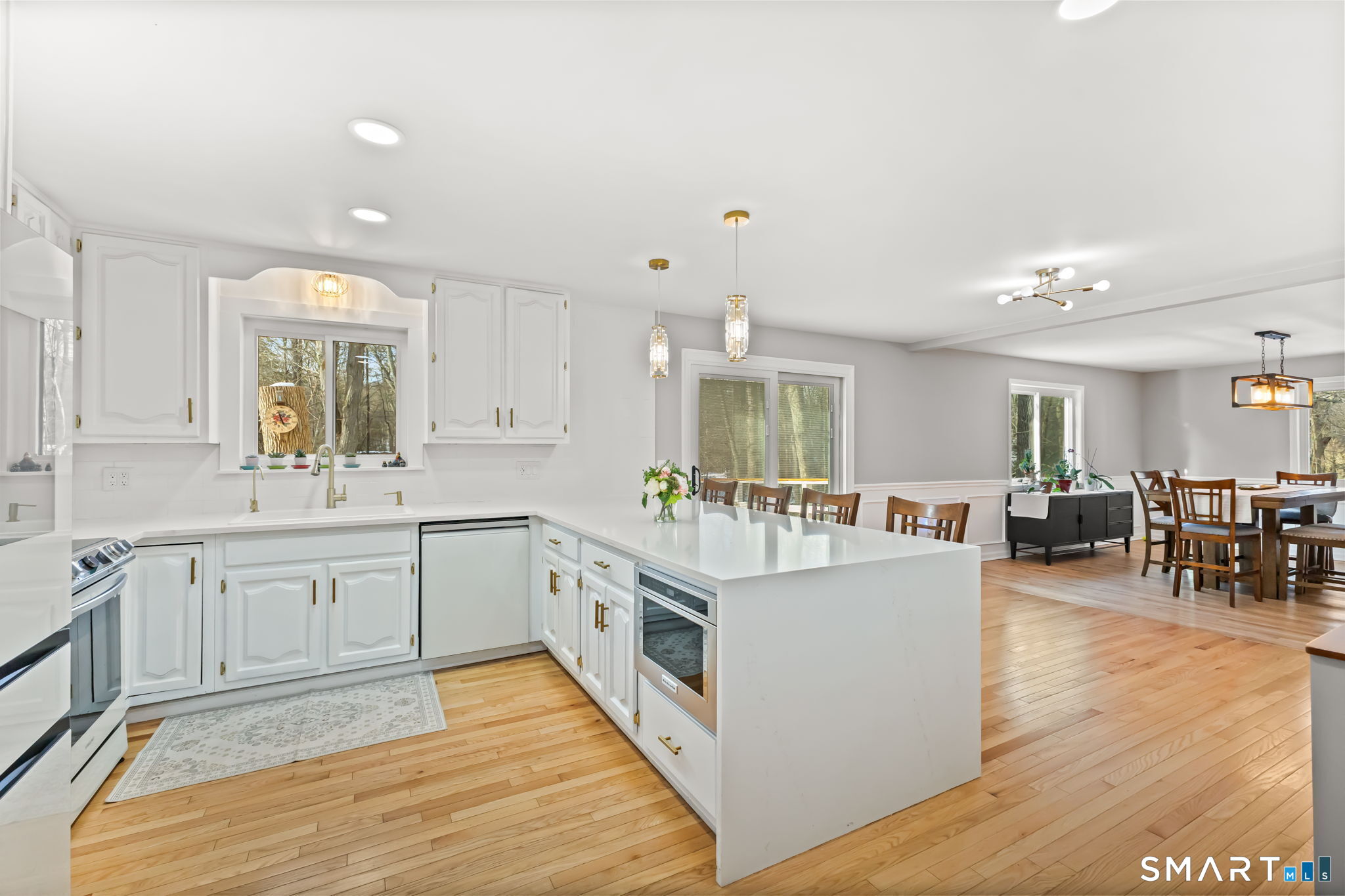 299 Redding Road Redding, CT 06896 - Photo 10 of 40 a large kitchen with stainless steel appliances granite countertop a large center island and a sink