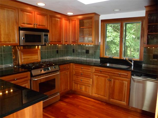 392 Point Road Marion, MA 02738 - Photo 2 of 21 a kitchen with stainless steel appliances a stove sink and microwave