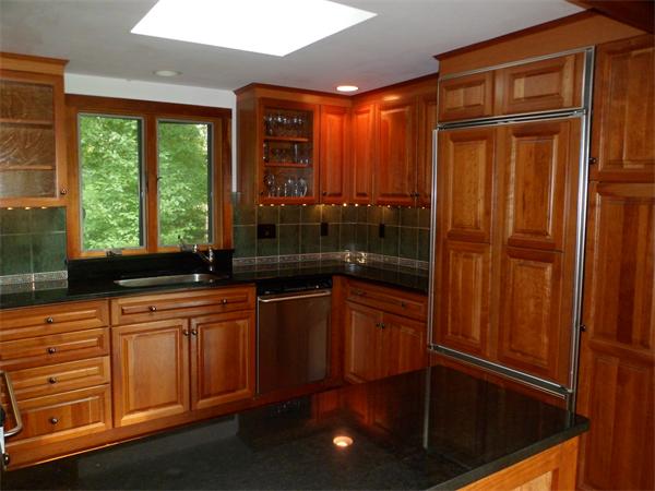 392 Point Road Marion, MA 02738 - Photo 3 of 21 a kitchen with stainless steel appliances granite countertop a refrigerator a sink and wooden cabinets