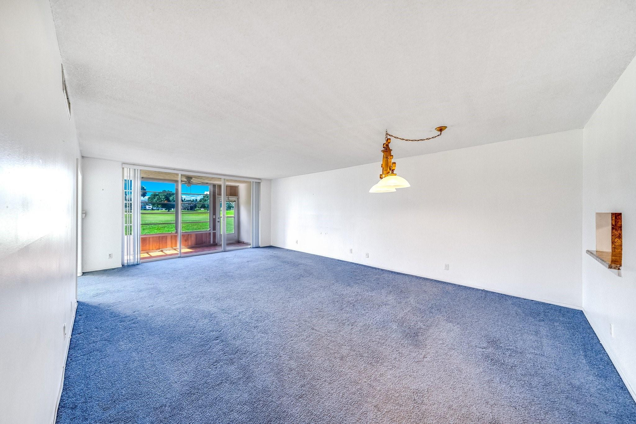 2601 South Course Drive, Unit 111 Pompano Beach, FL 33069 - Photo 2 of 44 Actual Living room and dining room