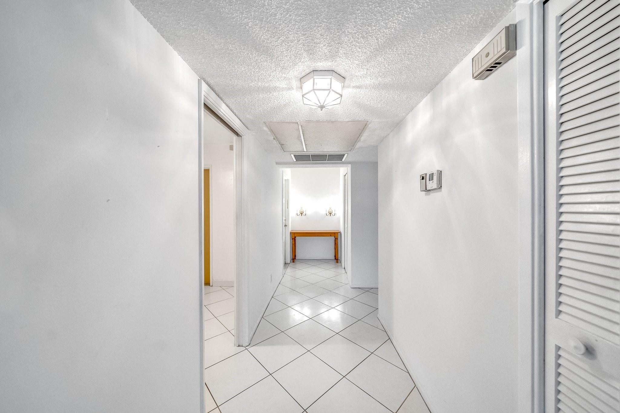 2601 South Course Drive, Unit 111 Pompano Beach, FL 33069 - Photo 30 of 44 entry hallway