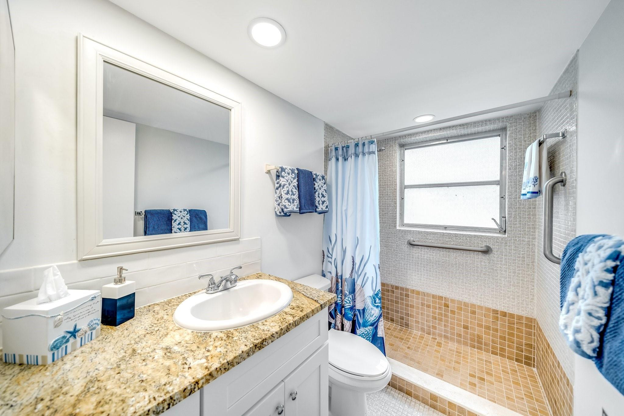 2601 South Course Drive, Unit 111 Pompano Beach, FL 33069 - Photo 9 of 44 guest bathroom