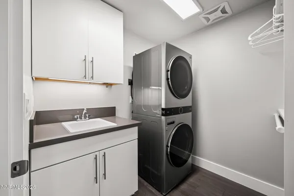 a bathroom with a sink and a washer dryer
