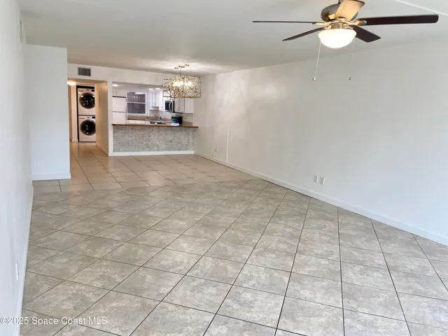 a view of a kitchen with a sink and cabinets