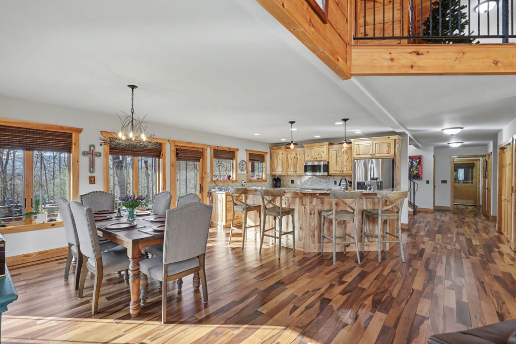 4760 Anderson Road Hiawassee, GA 30546 - Photo 22 of 104 a dining room with furniture wooden floor and a rug