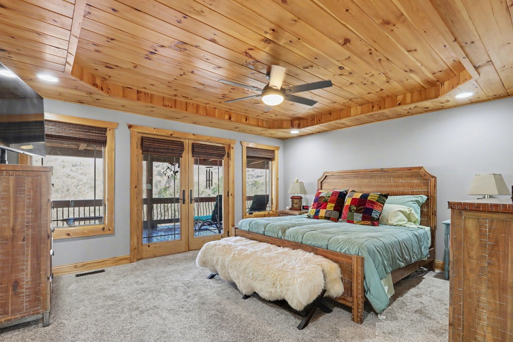 4760 Anderson Road Hiawassee, GA 30546 - Photo 30 of 104 a bedroom with a bed and a large window