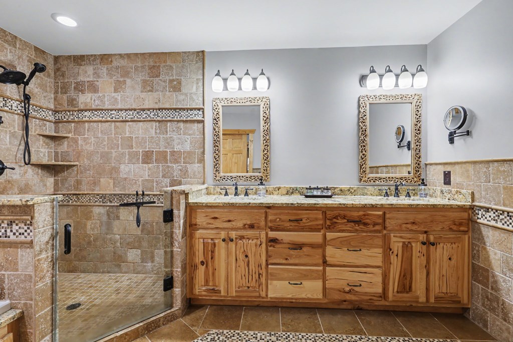 4760 Anderson Road Hiawassee, GA 30546 - Photo 37 of 104 a bathroom with a double vanity sink mirror and shower