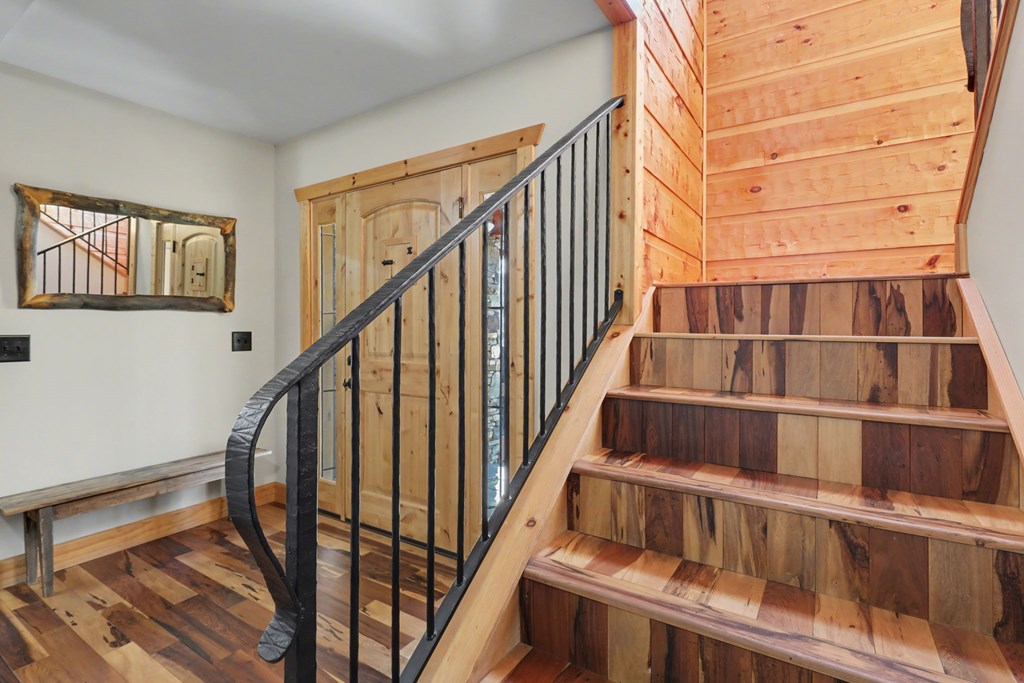 4760 Anderson Road Hiawassee, GA 30546 - Photo 46 of 104 a view of staircase with wooden floor and a window