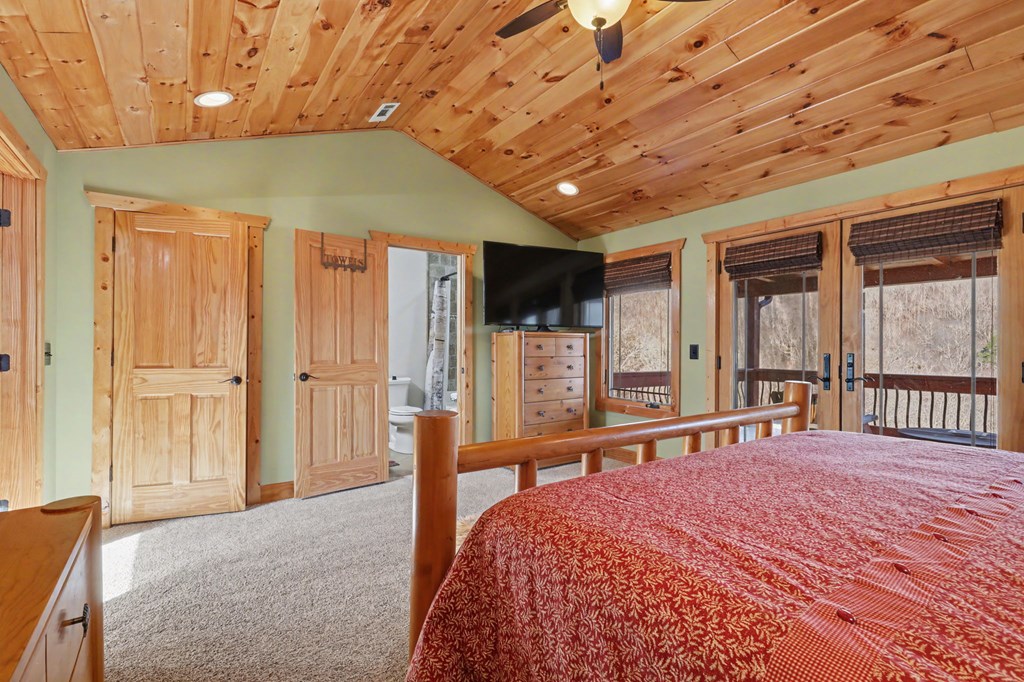 4760 Anderson Road Hiawassee, GA 30546 - Photo 49 of 104 a bedroom with a bed and a large window