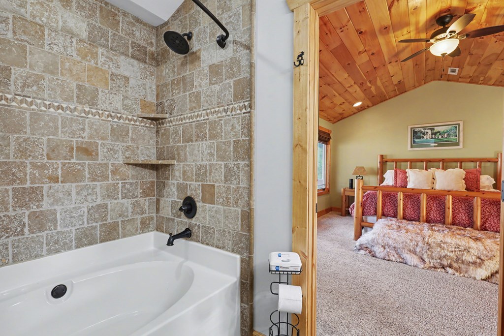 4760 Anderson Road Hiawassee, GA 30546 - Photo 55 of 104 a bathroom with a tub and shower