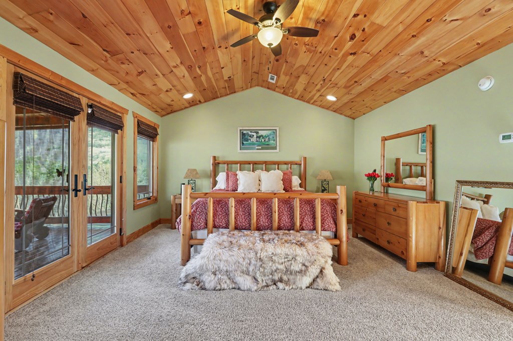 4760 Anderson Road Hiawassee, GA 30546 - Photo 56 of 104 a spacious bedroom with a bed and a large window