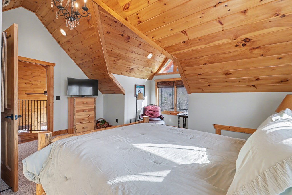 4760 Anderson Road Hiawassee, GA 30546 - Photo 60 of 104 a bedroom with a bed and a large window