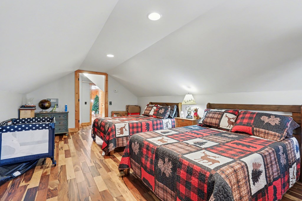 4760 Anderson Road Hiawassee, GA 30546 - Photo 66 of 104 a bedroom with double bed and a night stand