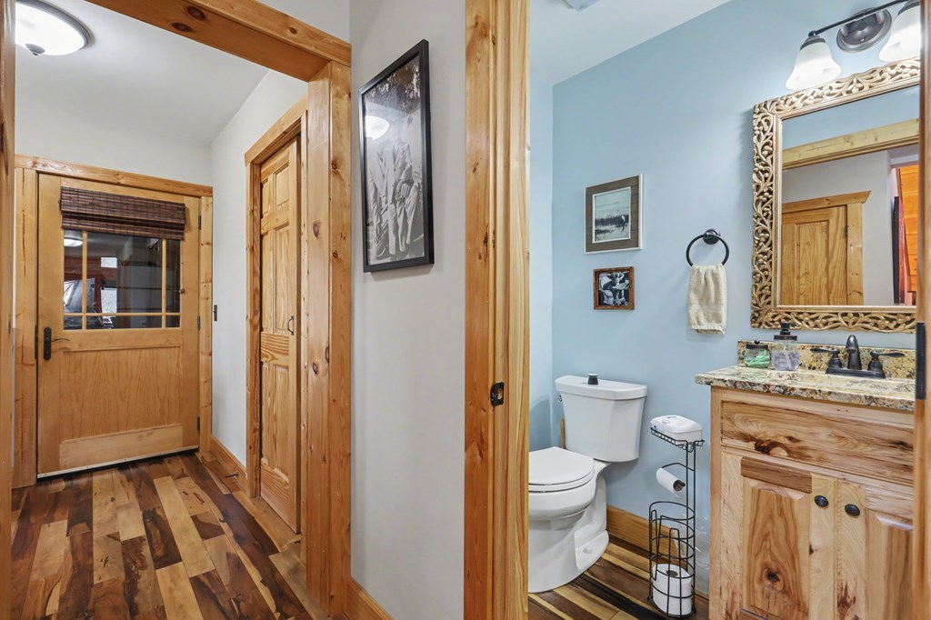 4760 Anderson Road Hiawassee, GA 30546 - Photo 69 of 104 a bathroom with a toilet sink and a mirror