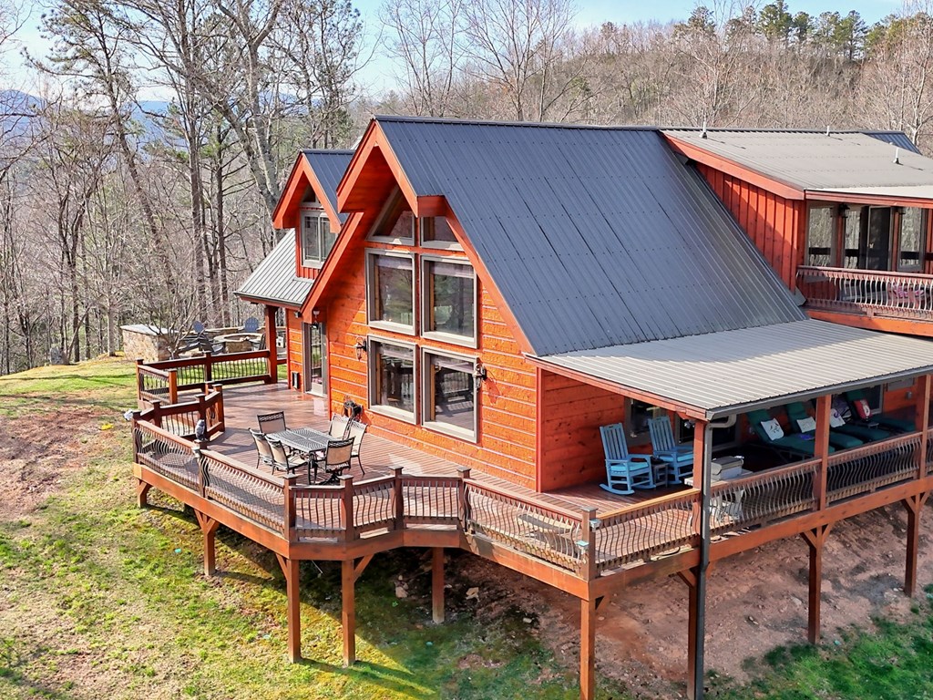 4760 Anderson Road Hiawassee, GA 30546 - Photo 76 of 104 a aerial view of a house with swimming pool and sitting area