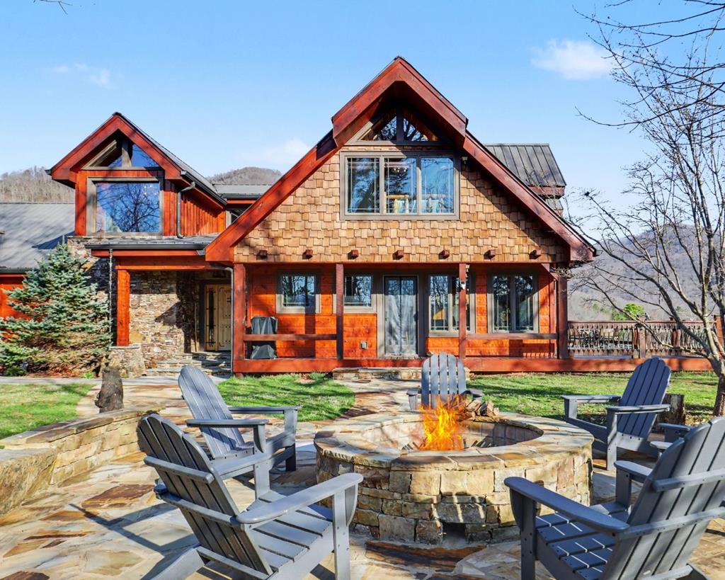 4760 Anderson Road Hiawassee, GA 30546 - Photo 89 of 104 a front view of a house with patio furniture and a garden
