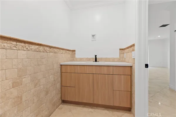 a view of an empty room and wooden floor