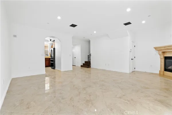 a kitchen with stainless steel appliances granite countertop a stove microwave and cabinets