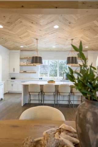 a kitchen with granite countertop a sink and cabinets