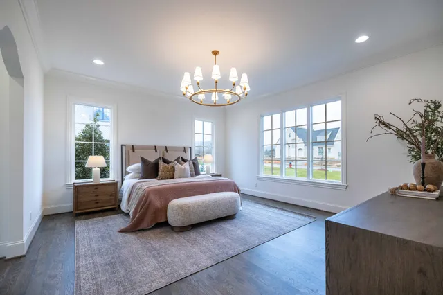 an empty room with a window and a ceiling fan