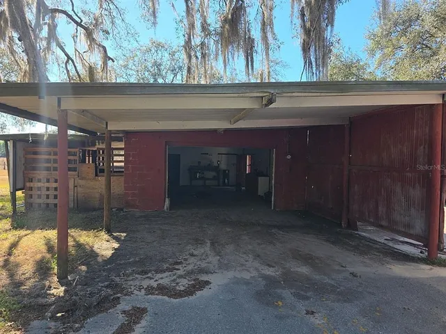 a view of a backyard of the house
