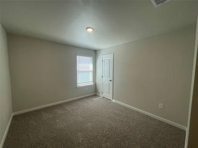 an empty room with a bathroom