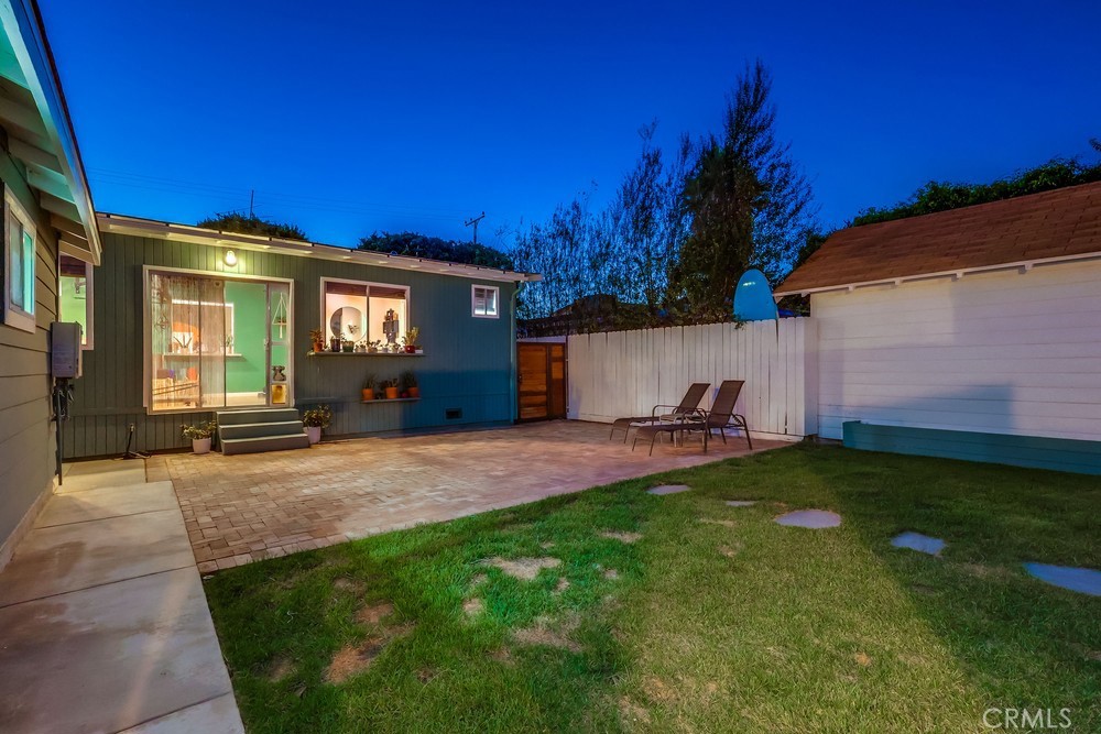 456 Cherry Avenue Long Beach, CA 90802 - Photo 11 of 74 a view of a house with backyard and a garden