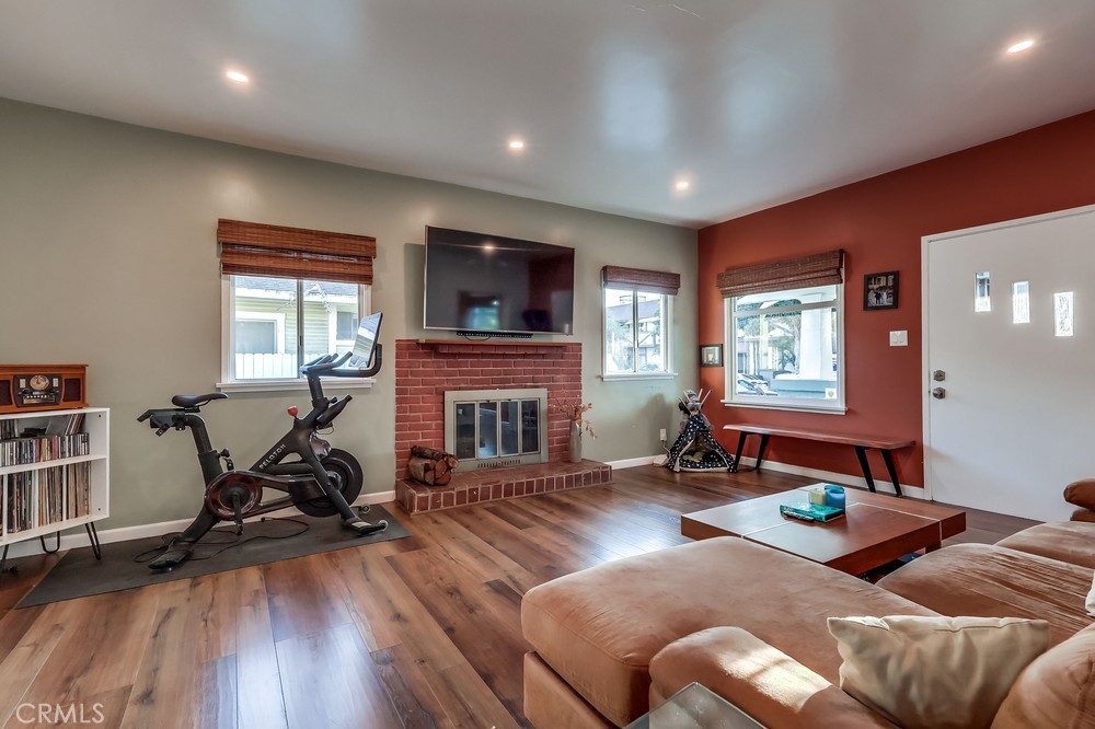 456 Cherry Avenue Long Beach, CA 90802 - Photo 19 of 74 a living room with furniture a window and a flat screen tv