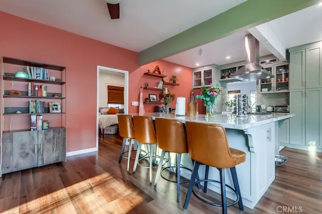 a kitchen with stainless steel appliances granite countertop a stove a refrigerator and a sink