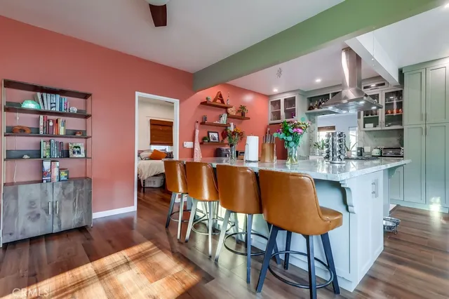 a kitchen with stainless steel appliances a sink and a refrigerator