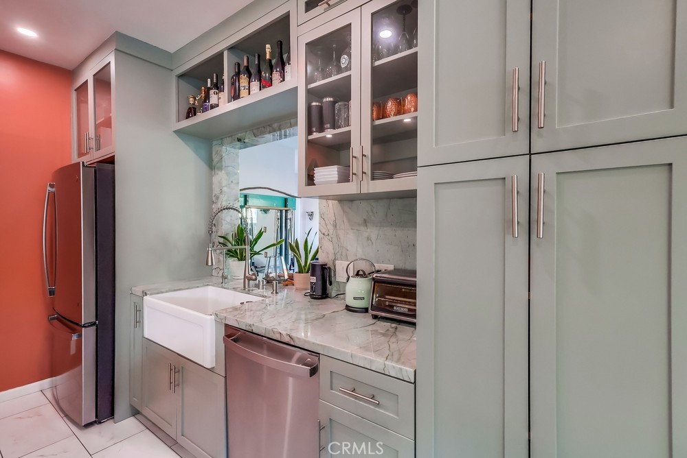 456 Cherry Avenue Long Beach, CA 90802 - Photo 31 of 74 a kitchen with stainless steel appliances a sink and a refrigerator