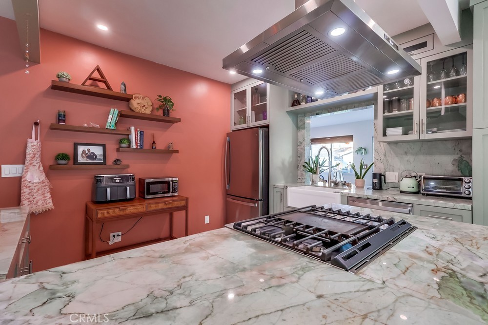 456 Cherry Avenue Long Beach, CA 90802 - Photo 32 of 74 a kitchen with stainless steel appliances granite countertop a stove a refrigerator and a sink