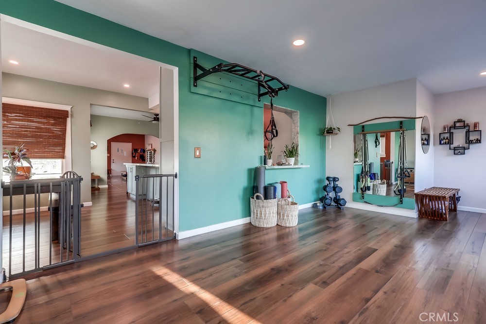 456 Cherry Avenue Long Beach, CA 90802 - Photo 39 of 74 a living room with lots of wooden furniture and a refrigerator