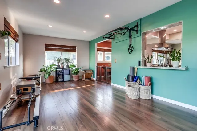 a view of walk in closet with clothes