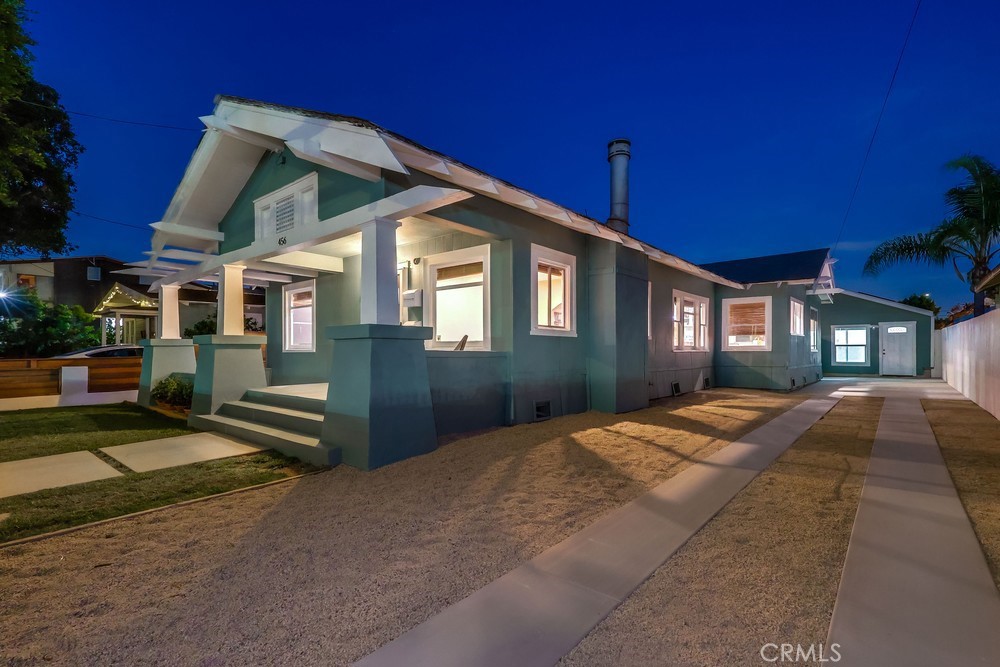 456 Cherry Avenue Long Beach, CA 90802 - Photo 4 of 74 a front view of a house with a yard