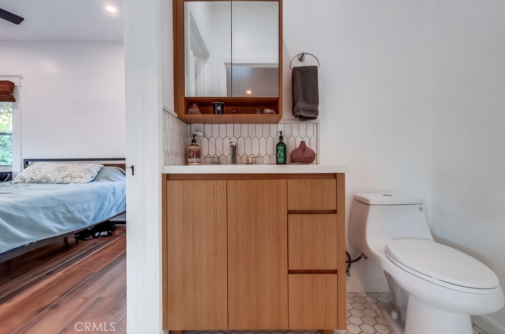 456 Cherry Avenue Long Beach, CA 90802 - Photo 47 of 74 a bathroom with a sink toilet and mirror