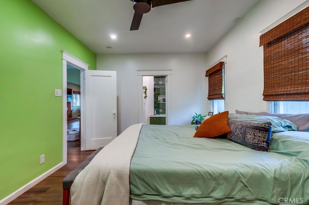 456 Cherry Avenue Long Beach, CA 90802 - Photo 52 of 74 a bedroom with a large bed and a chandelier