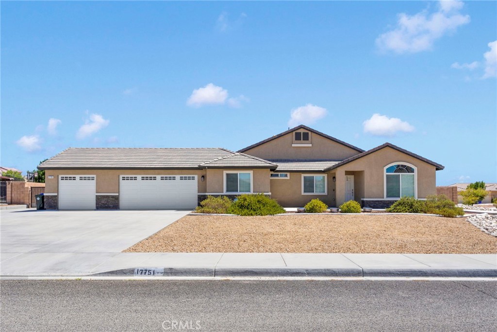 17751 Cabazon Road Apple Valley, CA 92307 - Photo 1 of 1 a front view of a house with a yard and garage