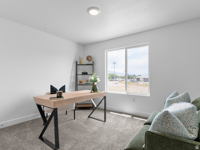 738 West 2840 South, Unit 6 Nibley, UT 84321 - Photo 15 of 23 Bright room featuring a large window, recessed lighting, white walls, and neutral carpet flooring