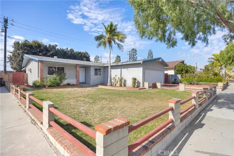 a view of house with outdoor space and swimming pool